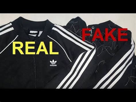 fake adidas jacket|how to spot a fake adidas.